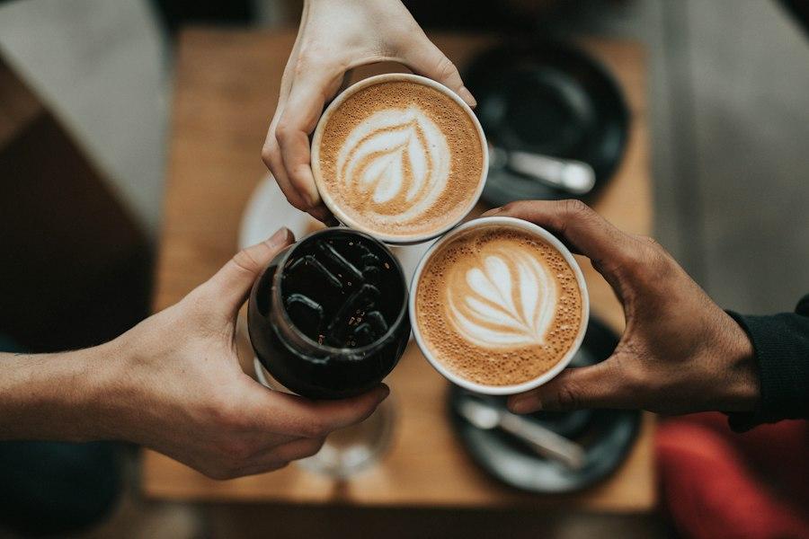 Friends raising coffee cups